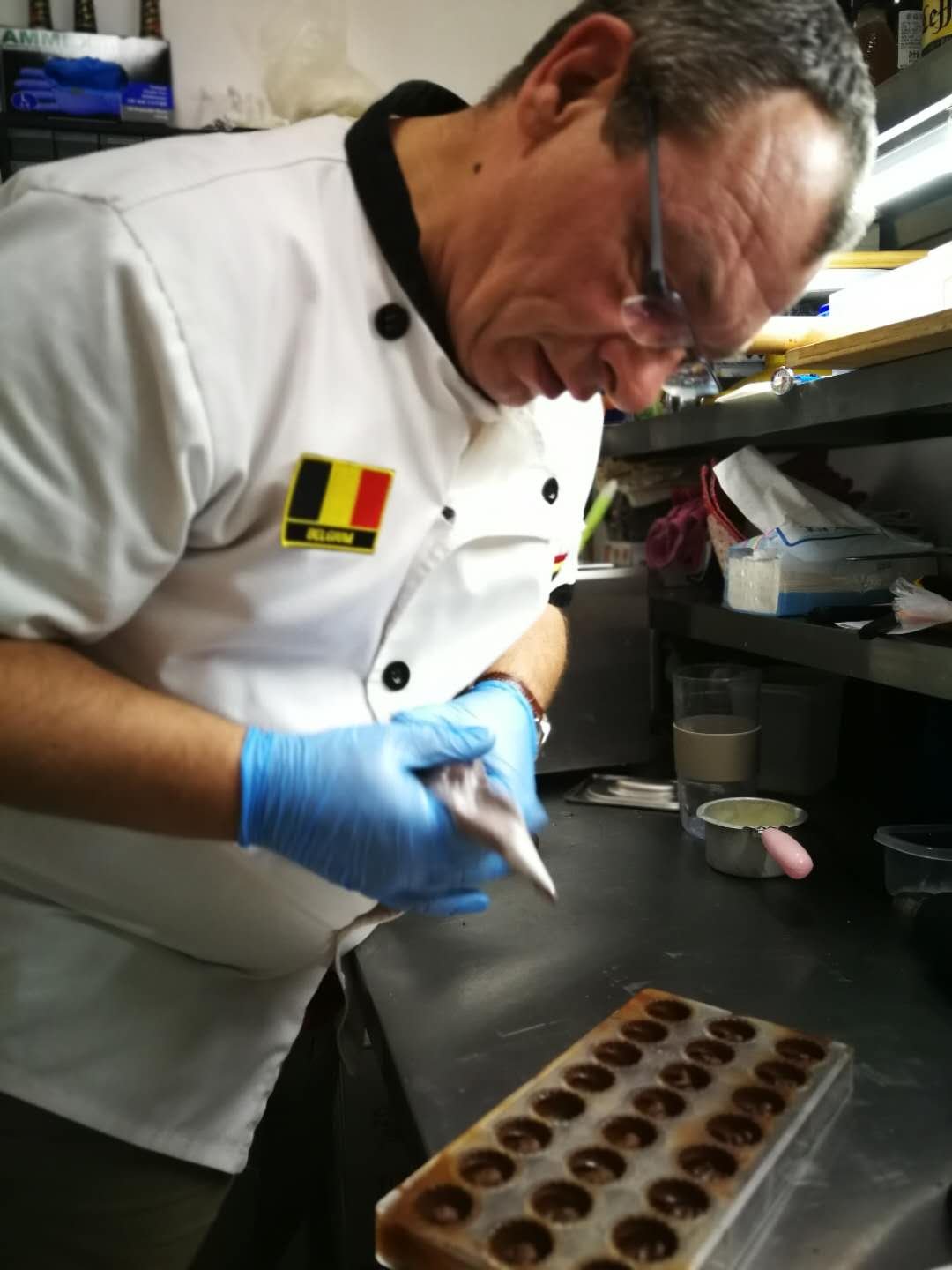 Olivier preparing chocolate in the restaurant kitchen